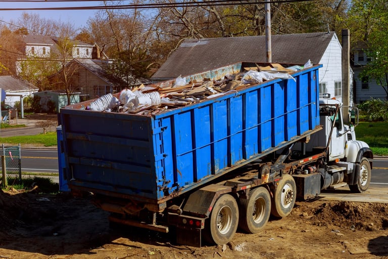 Professional junk removal team loading truck in Bucks County PA