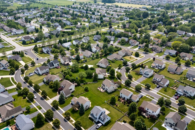 Professional pressure washing technician cleaning home exterior in Langhorne PA